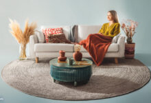 themed living room with a white sofa and cozy brown pillows, paired with, The Future of Home Improvements: Trends and Innovations